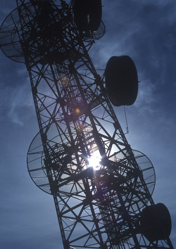 Backlit photo of a communications mast