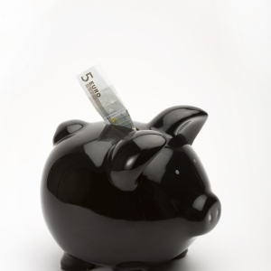 Black piggy bank with euros