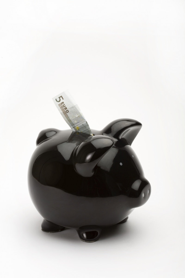 Black piggy bank with euros