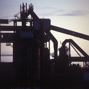 A silhouette of a large sand and gravel works