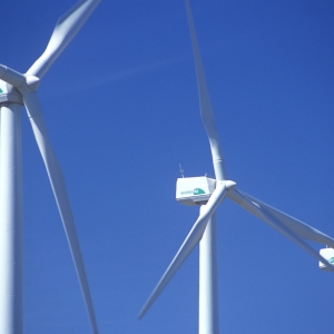 Wind turbines against a clear blue sky