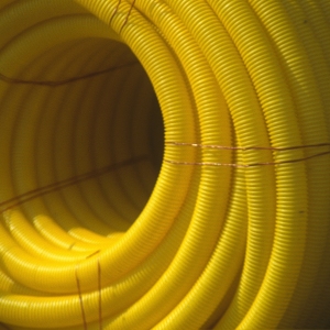 A large coil of yellow plastic piping