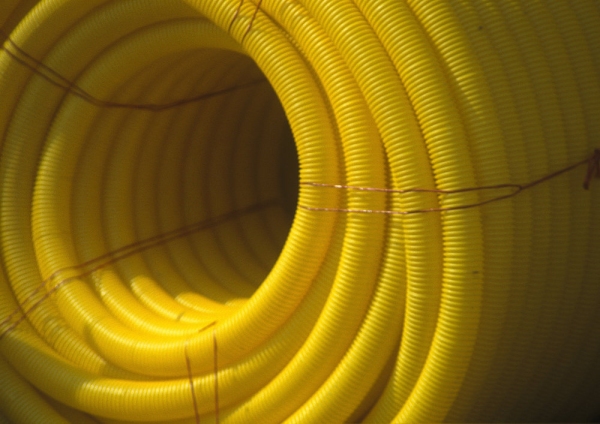 A large coil of yellow plastic piping