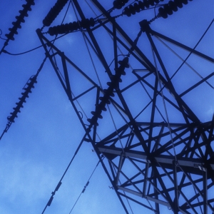 Electricity pylons against a clear blue sky