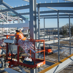 Workers on a large commercial construction site