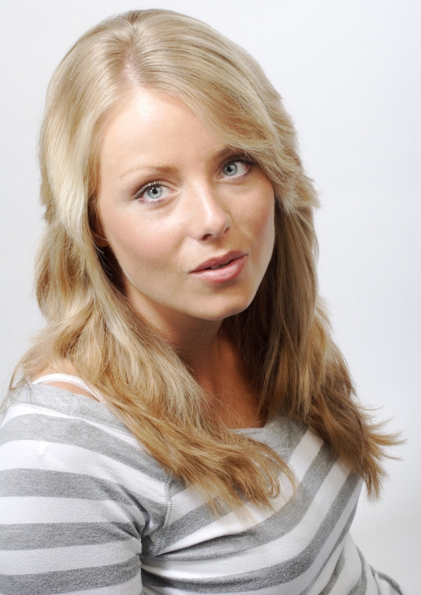 Pretty blonde girl in a striped top looking up at the camera