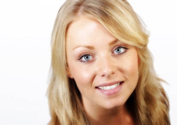 Pretty blonde girl smiling at the camera