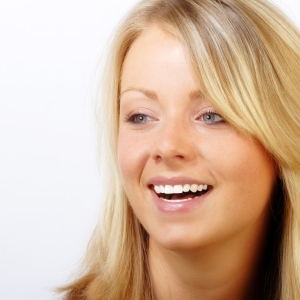 Pretty blonde girl smiling and happy