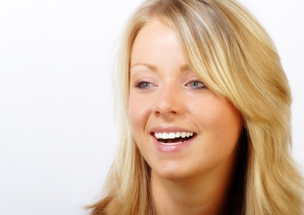 Pretty blonde girl smiling and happy