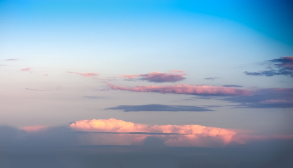 Horizontal dramatic clouds over island landscape background