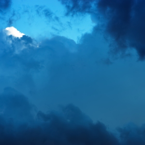 Blue and white cumulo nimbus storm clouds