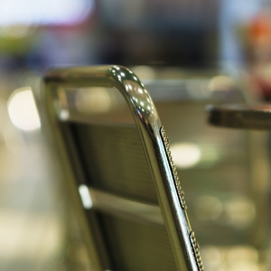 Stylish cafe chair with out of focus background