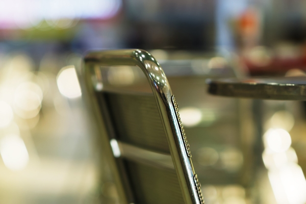 Stylish cafe chair with out of focus background