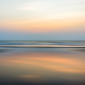 Blurred seascape with evening sunset background and distant horizon