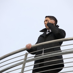 A security guard scanning the area from a high vantage point