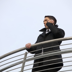 A security guard scanning the area from a high vantage point