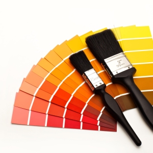 Fan of colour swatches with two paintbrushes