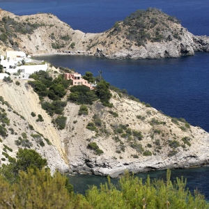 The rocky coastline of North Western Ibiza with clifftop villas