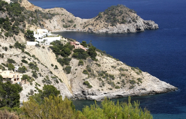 The rocky coastline of North Western Ibiza with clifftop villas