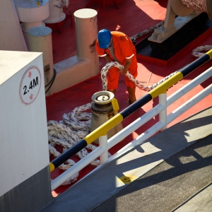 A deckhand on a North Sea ferry arranging anchor ropes