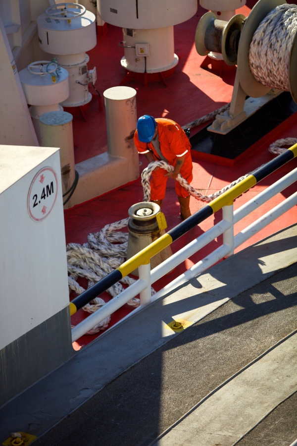 A deckhand on a North Sea ferry arranging anchor ropes