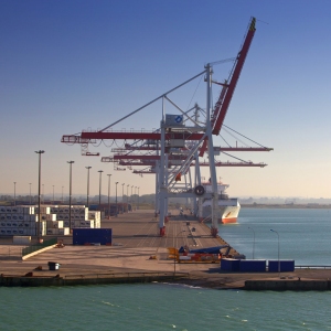 A container ship unloading at a European port