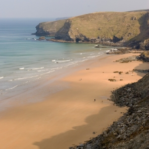 An aerial view of the cliffs and beach at Watergate Bay, Cornwall