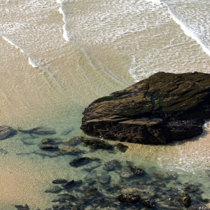 Big rocks on a big beach at low tide