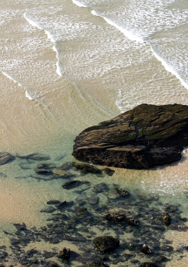 Big rocks on a big beach at low tide