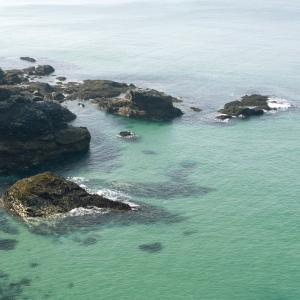 Big rocks on a big beach at low tide