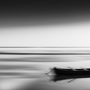 A boat moored in the sunset. Motion blur for effect