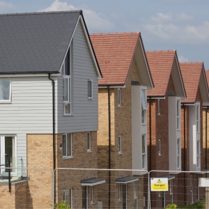 A row of new houses on a large development nearing completion