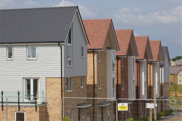 A row of new houses on a large development nearing completion