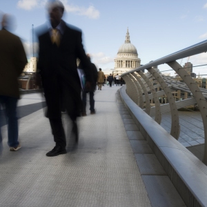 Pedestrians on the 'wobbly bridge over the River Thames in London