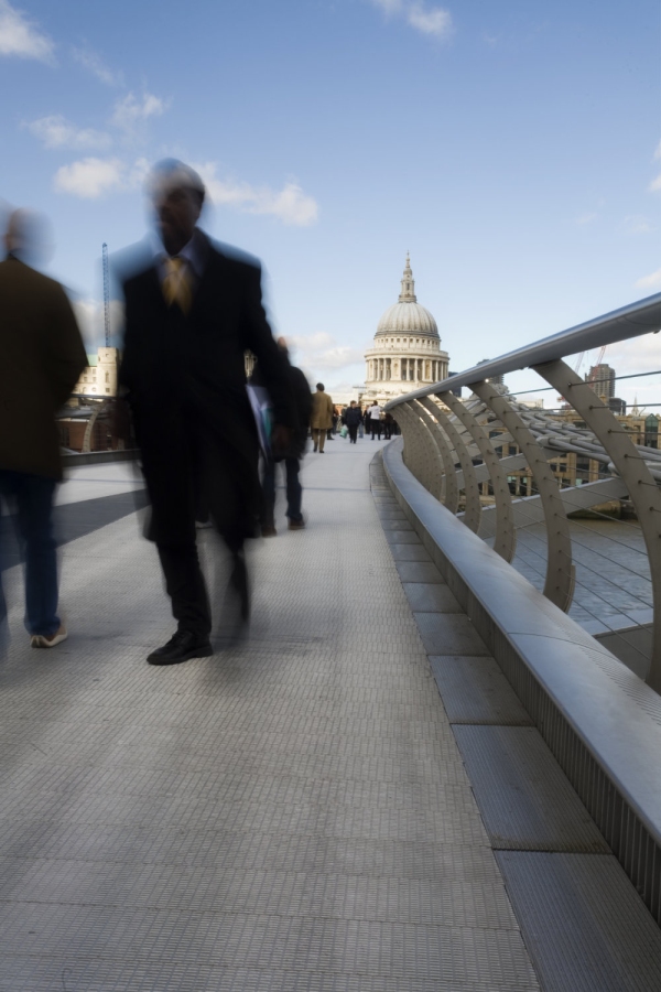 Pedestrians on the 'wobbly bridge over the River Thames in London