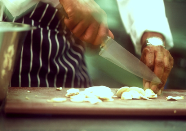 preparing mushrooms on a wooden chopping board