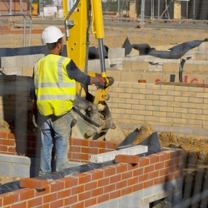 A construction worker supervising ground works