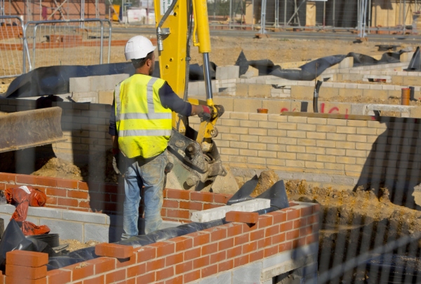 A construction worker supervising ground works