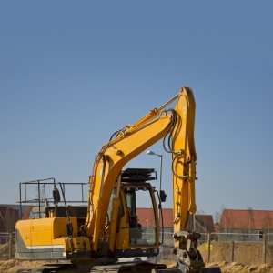 A digger or earth mover or backhoe on a construction site or building site