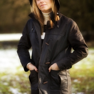 Pretty girl wearing a leather coat on a winter's day