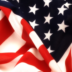 A close up view of the US flag showing the stars and stripes