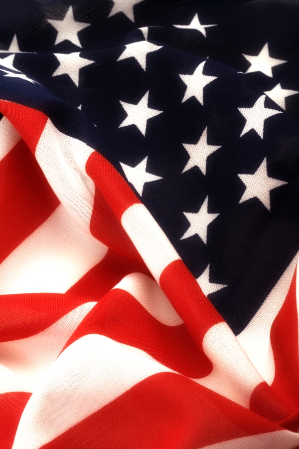 A close up view of the US flag showing the stars and stripes