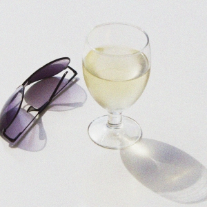 sunglasses and a glass of wine, manipulated image