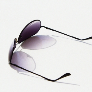 Sunglasses on a tabletop, manipulated image