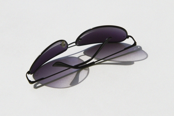 a pair of aviator style sunglass on a table top