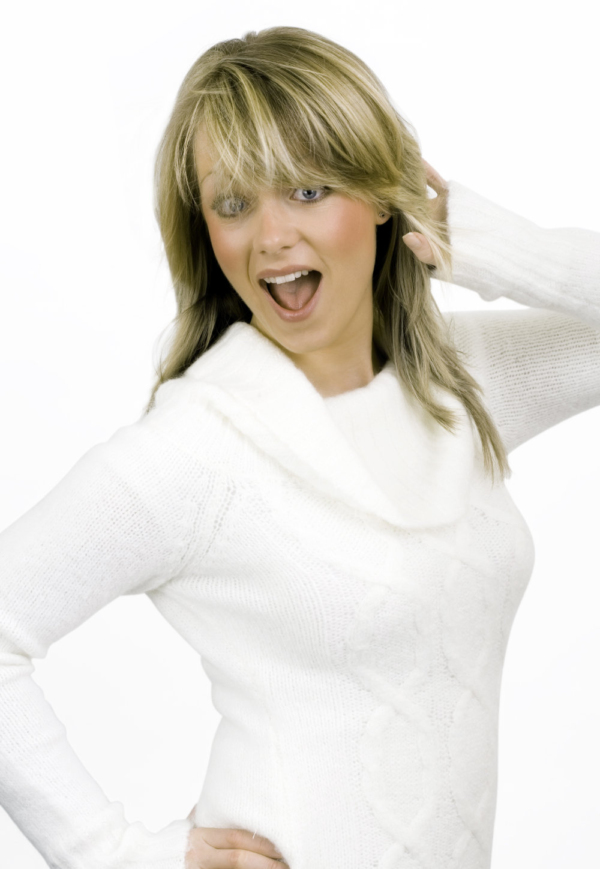 A pretty blonde girl having fun, white background