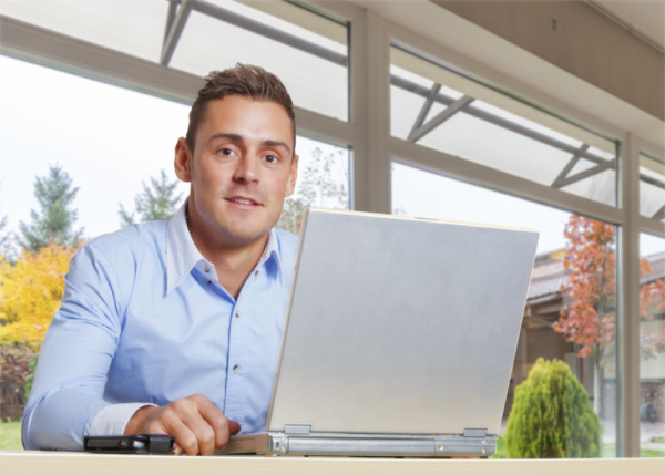 Young man at work on a laptop computer