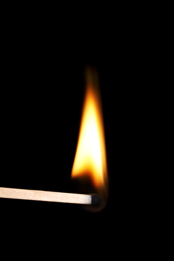 Lighted match with tall flame