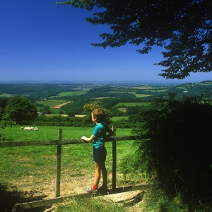 A young boy admiring the countryside in the Auvergne, Southern France