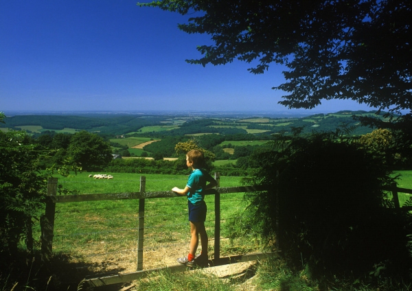 A young boy admiring the countryside in the Auvergne, Southern France